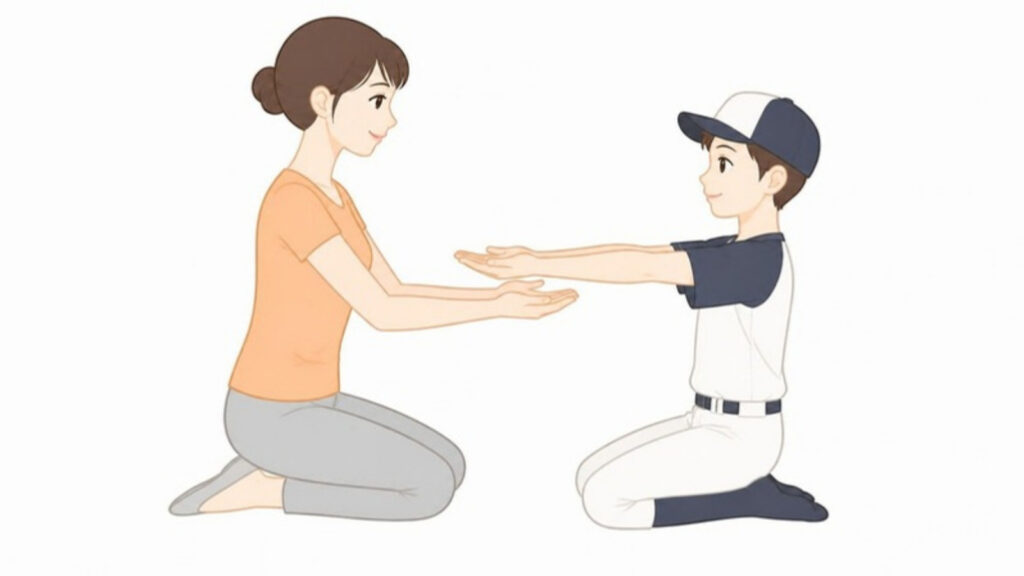 保護者が子どもの肘の伸び方を左右で確認する